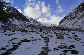 Maninda tal lake ahead in the har ki dun valley is covered with the snow in the December.